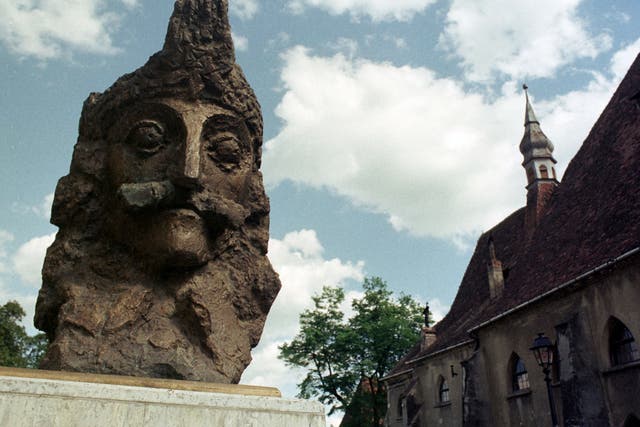 <p>A bust of Vlad Dracula “The Impaler” Tepes sits in the centre of Sighisoara in Romania on 10 May 2001</p>
